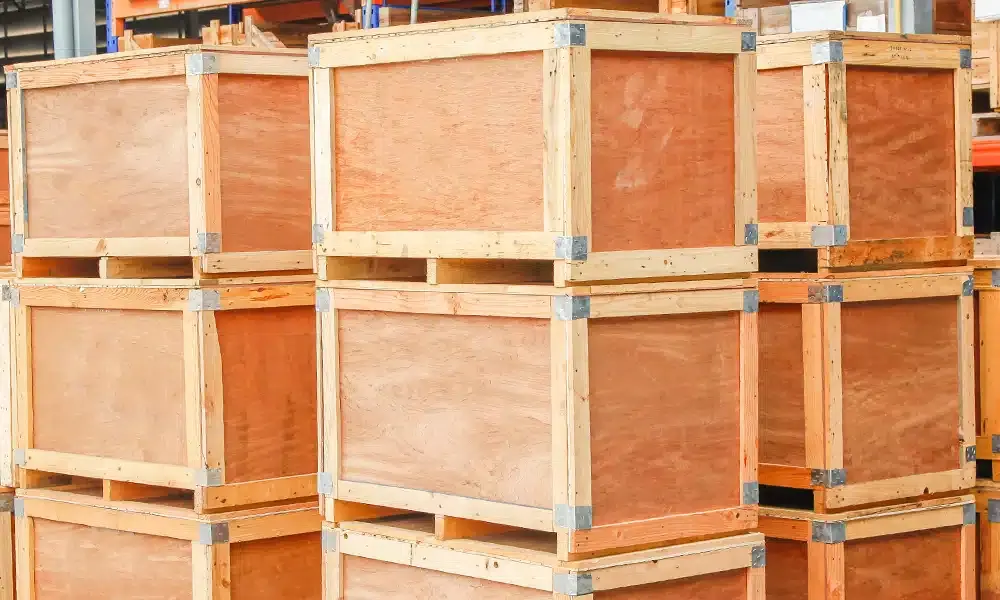 Stacked wooden export crates outdoor storage near Riyadh - bulk wooden crate inventory for logistics and international shipping operations